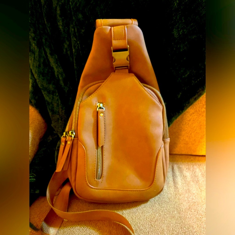 Women's crossbody brown leather bag.